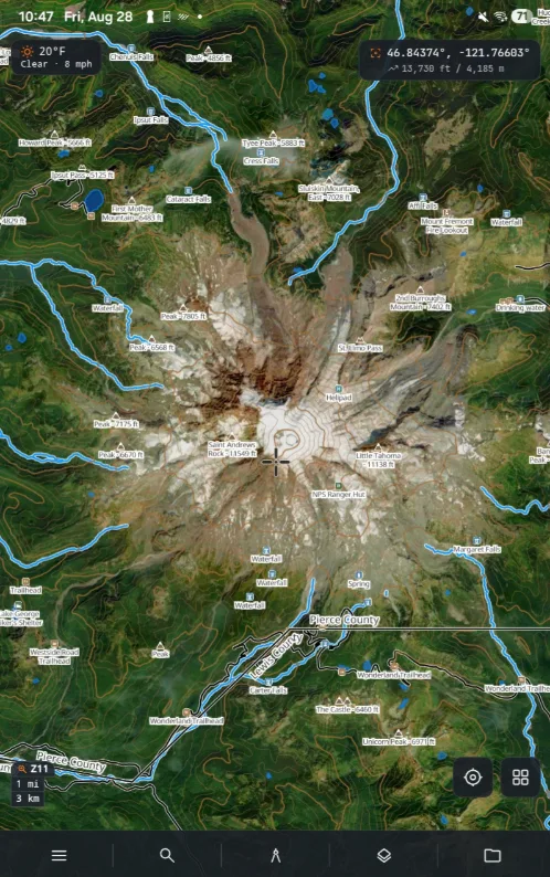 ZYRNTOPO on Android: satellite imagery of Mount Rainier under labelled contour lines, with named peaks, waterfalls and trailheads, a live weather and coordinate readout, and a scale bar.
